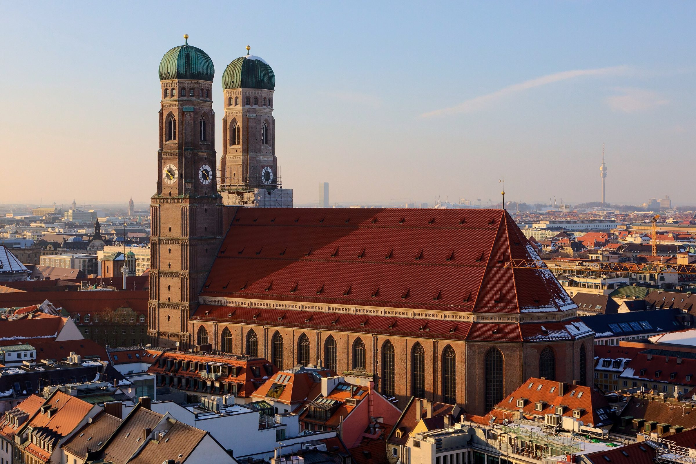 The twin domes of the Frauenkirche above Munich's rooftops at dusk