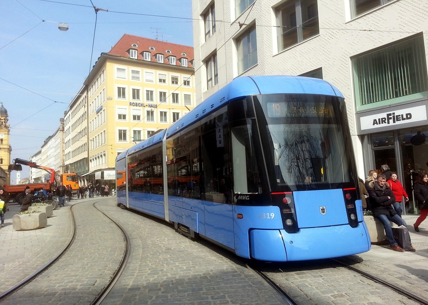 A modern tram in a Munich pedestrian street